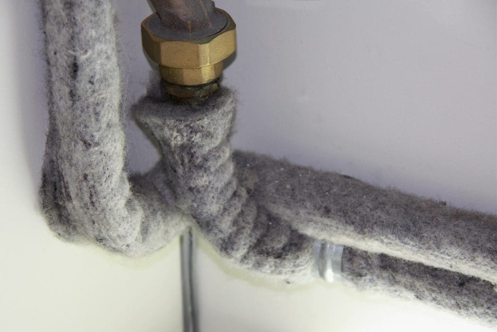 Pipe lagging wool insulation on plumbing pipes